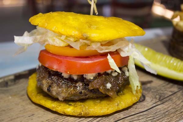 Inti sirloin burger patty topped with bleu cheese, tomato, onion, shredded lettuce